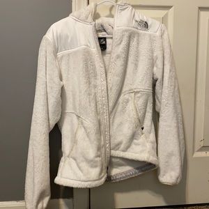 White fuzzy north face jacket
